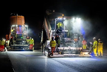 Night-Time-Highway-Resurfacing-Project-with-Heavy-Machinery-scaled sm